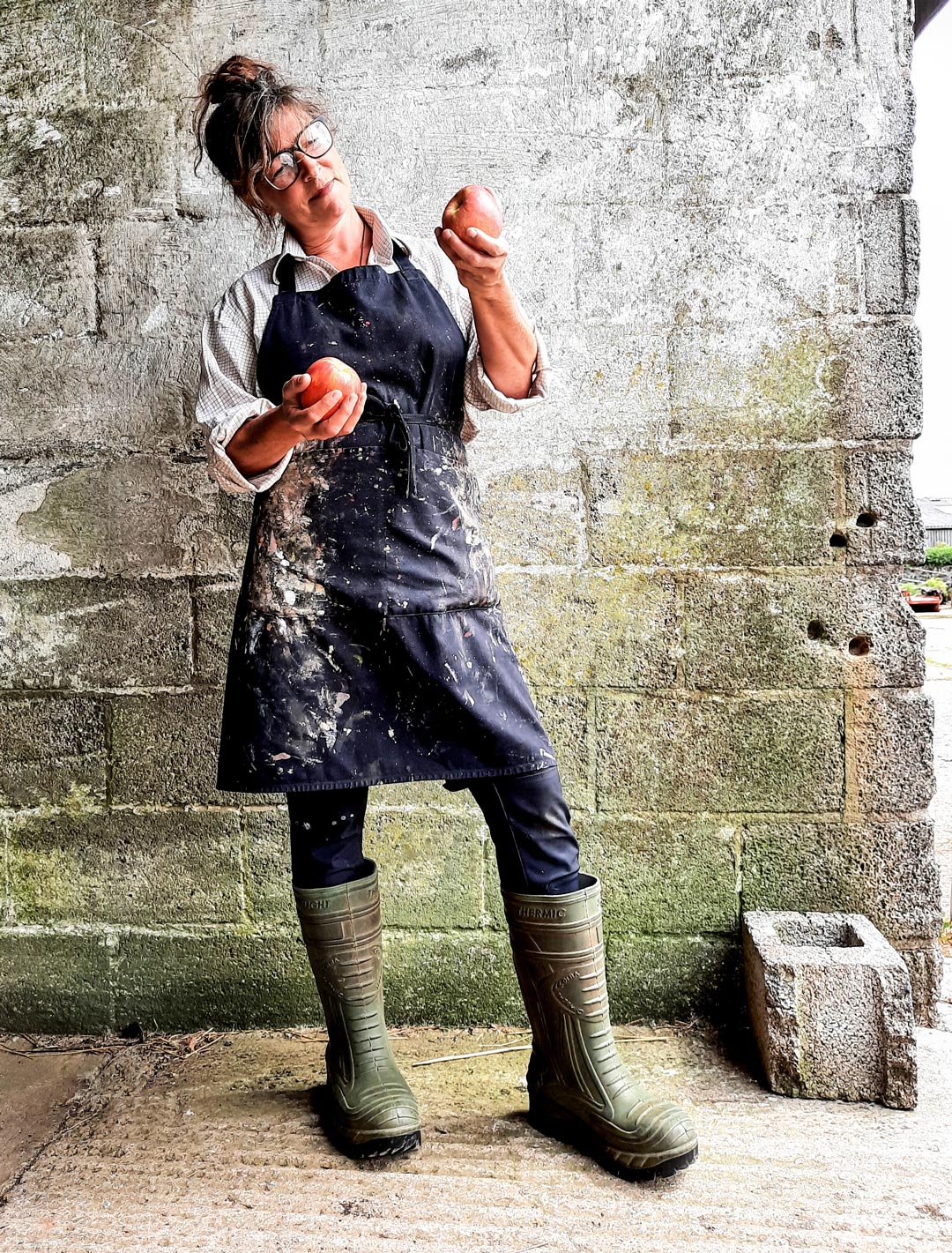 Lottie Sweeney with Fuji, an apple model commissioned by the Museum of Cider for Apples & People. Photograph Neil Tustian ©